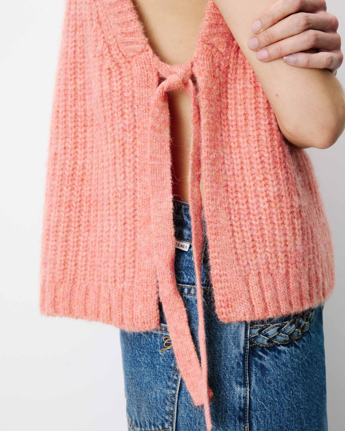 Sleeveless side-tie sweater peche Argan