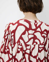 Geometric-print V-neck blouse terracotta Ambrine