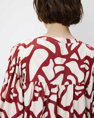 Blouse col V à imprimé géométrique terracotta Ambrine